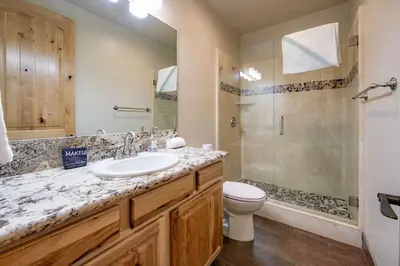 a bathroom with a sink and a shower and a toilet at The T-Pot Chalet for 12 in South Lake Tahoe
