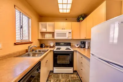 a kitchen with a sink and a white refrigerator at Galaxy Way Close to Stagecoach Chair in Stateline