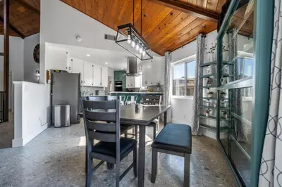 a kitchen with a table and chairs in a room at OctaFarmRetreat - Gateway To Sequoia Natl Park in Visalia
