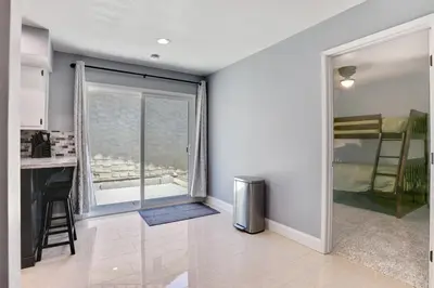a living room with a kitchen and a window at The Royal Oak Splash Sequoia Nat'l Park Lake Mts in Visalia