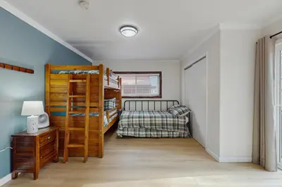 a bedroom with a bunk bed and a bed at The Regan Beach Vista in South Lake Tahoe