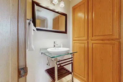a bathroom with a sink and a mirror at Waterfront Bliss in South Lake Tahoe