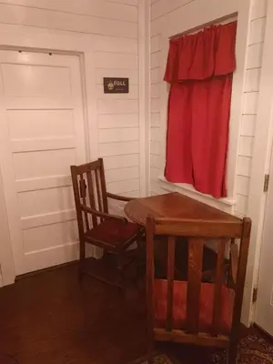 a room with a table and two chairs and a window at Meadow Creek Cabin in Camino