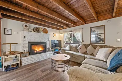a living room with a couch and a fireplace at HCH0648 - Larchwood Lodge home in South Lake Tahoe