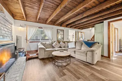 a living room with a couch and a table at HCH0648 - Larchwood Lodge home in South Lake Tahoe