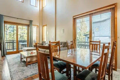 a dining room with a table and chairs at Mammoth Green #220 - Nearly Ski-In Ski-Out 3 Bedroom 2 Bath, Sleeps 8 in Mammoth Lakes