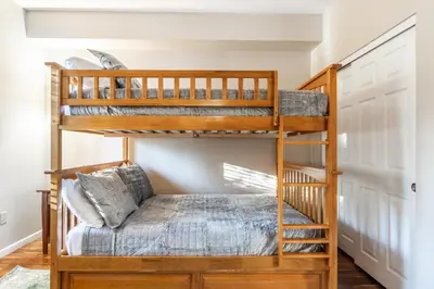 a bunk bed in a room with a bunk bed in a house at Mammoth Green #220 - Nearly Ski-In Ski-Out 3 Bedroom 2 Bath, Sleeps 8 in Mammoth Lakes