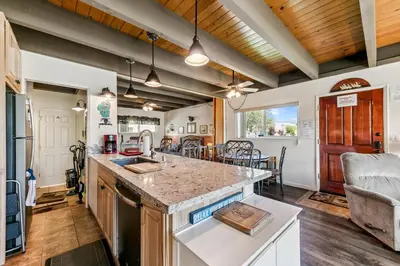 a kitchen with a counter top and a dining room at Tahoe Keys Studio Condo in South Lake Tahoe