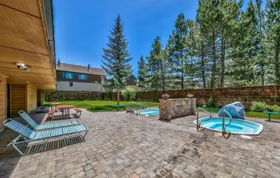 a backyard with a swimming pool and a playground at Tahoe Keys Studio Condo in South Lake Tahoe