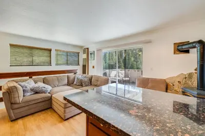 a living room with a couch and a table at Quaking Aspen Condo in Stateline