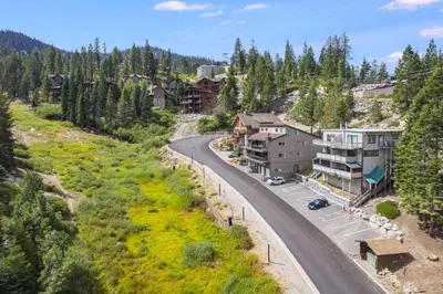 a winding road in a mountain village with houses at Quaking Aspen Condo in Stateline