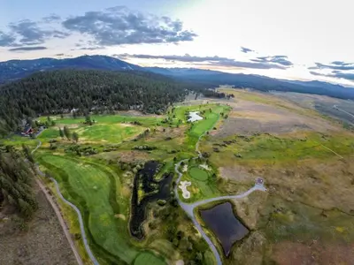 an aerial view of a golf course in the mountains at Indian Hills 6021 townhouse in Truckee