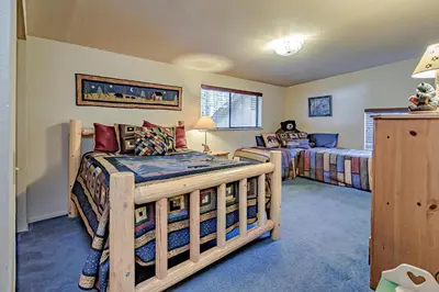 a bedroom with two bunk beds in a room at Lake Tahoe West Shore Lake Front 5 bedroom Cabin in Homewood