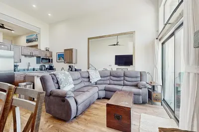a living room with a couch and a kitchen at Lakeview Landing in Stateline