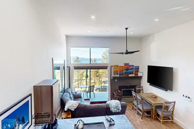 a living room with a couch and a table at Lakeview Landing in Stateline