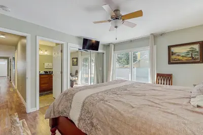 a bedroom with a bed and a ceiling fan at South Lake Tahoe Charm in South Lake Tahoe