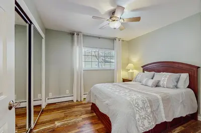 a bedroom with a bed and a ceiling fan at South Lake Tahoe Charm in South Lake Tahoe
