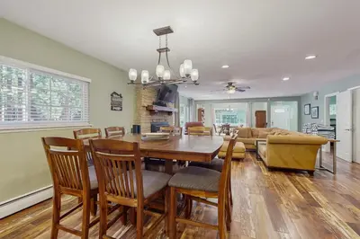 a dining room and living room with a table and chairs at South Lake Tahoe Charm in South Lake Tahoe