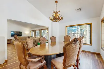 a dining room with a table and chairs at Serene Road Lodge in Soda Springs