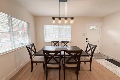 a dining room with a wooden table and chairs at Sierra Pines Retreat Tahoe in South Lake Tahoe