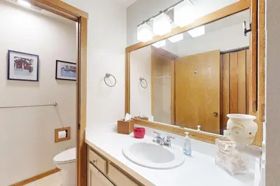 a bathroom with a sink and a mirror at Snowcreek 51 in Mammoth Lakes