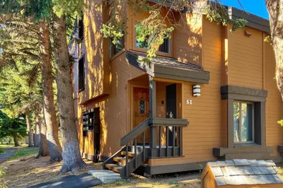 a house with a tree in front of it at Snowcreek 51 in Mammoth Lakes