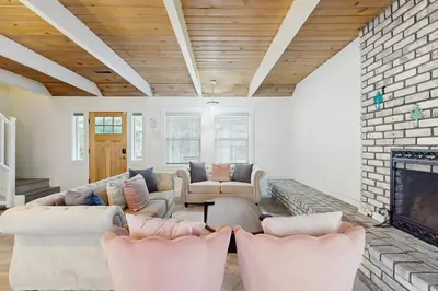a living room with couches and a fireplace at Meyers Tahoe Escape in South Lake Tahoe