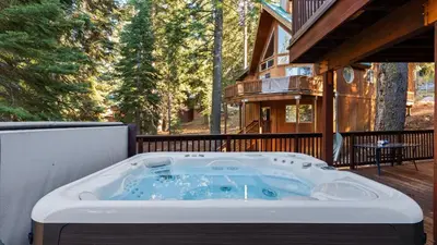 a hot tub on the back of a house at Hot Tub Sauna Forest Views in Tahoe Donner Cedar Summit by Avantstay in Truckee