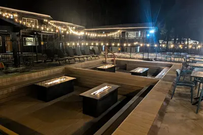 a restaurant with tables and chairs and lights at The Iceberg Tahoe in South Lake Tahoe