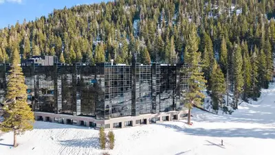 an aerial view of a building in the snow at Remodeled Second Floor Valley View suite in Olympic Valley