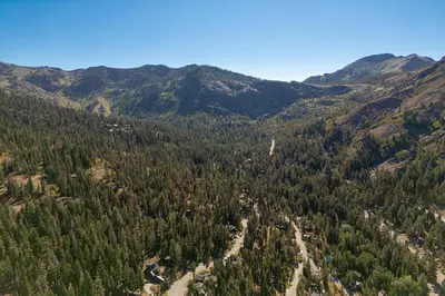 an aerial view of a forest in the mountains at Panoramic Peaks at Alpine by Tahoe Getaways - Pet Friendly, AC, Hot Tub, Shuttle & Stunning Views in Alpine Meadows