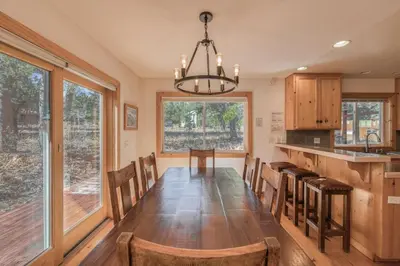 a dining room with a long table and chairs at Sparrow's Rest by Tahoe Getaways - Pet-Friendly 3BR in Tahoe Donner w HOA in Truckee