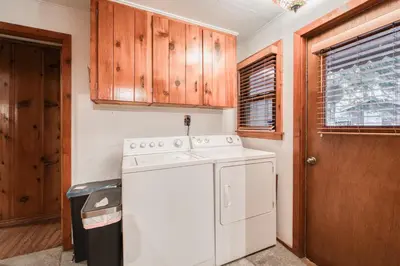a kitchen with a white stove and a dishwasher at Diana's Cabin by Tahoe Getaways - Pet-Friendly 2BR in Kings Beach w Backyard & Walk to Lake! in Tahoe Vista