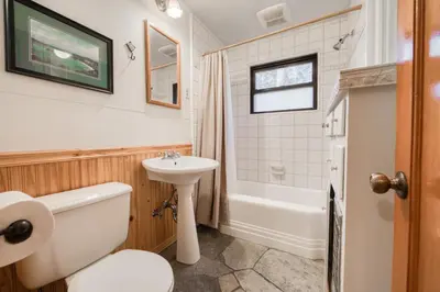 a bathroom with a toilet and a sink and a tub at Diana's Cabin by Tahoe Getaways - Pet-Friendly 2BR in Kings Beach w Backyard & Walk to Lake! in Tahoe Vista