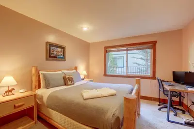 a bedroom with a bed and a desk and a computer at Knotty by Nature 3 bed home in South Lake Tahoe