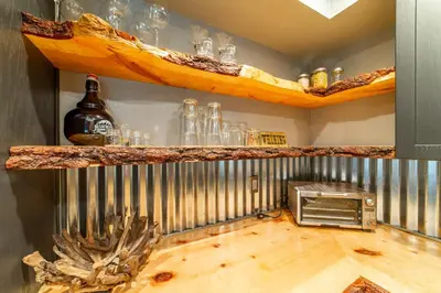 a room with a counter with glasses on it at Tranquil & Woodsy 2/2 Retreat – Jacuzzi, W/D, BBQ! in Mammoth Lakes