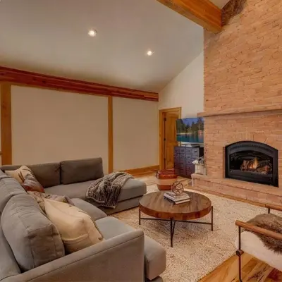 a living room with a couch and a fireplace at Mammoth Lakes Alpine Stay in Mammoth Lakes