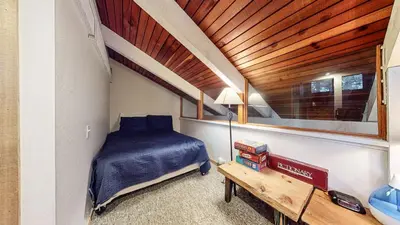 a bedroom with a bed and a wooden ceiling at Horizons 4 120 Great Complex Amenities, On The Shuttle Route, Walk To Shops and Restaurants condo in Mammoth Lakes