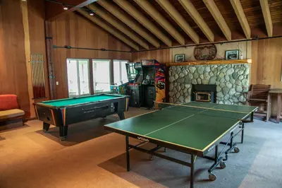 a room with a pool table and a fireplace at Horizons 4 120 Great Complex Amenities, On The Shuttle Route, Walk To Shops and Restaurants condo in Mammoth Lakes