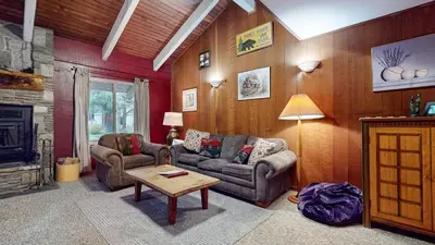 a living room with two couches and a table at Horizons 4 120 Great Complex Amenities, On The Shuttle Route, Walk To Shops and Restaurants condo in Mammoth Lakes