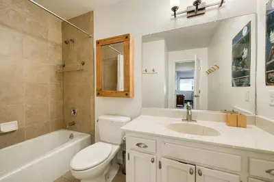 a bathroom with a sink and a toilet and a tub at Ridge Court # 13 by Tahoe Getaways - 3BR Palisades at Alpine Condo w Ski Shuttle & Tennis! in Alpine Meadows