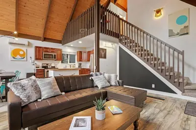 a living room with a couch and a table at 