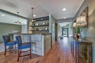 a kitchen with a bar and two chairs at 2030 Marconi Way home in South Lake Tahoe