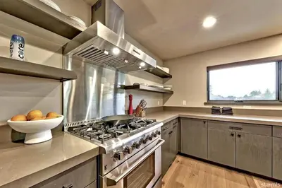 a kitchen with a stove and a bowl of fruit at 2030 Marconi Way home in South Lake Tahoe