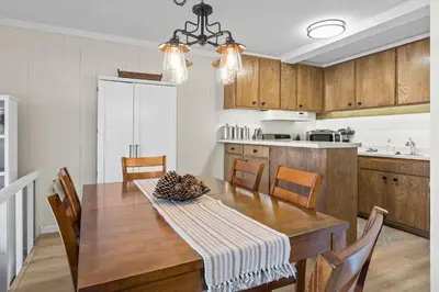 a kitchen and dining room with a wooden table at TKC0693- Keys Dream townhouse in South Lake Tahoe