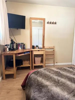 a bedroom with a wooden desk with a mirror at CYH0822 - Pinter Pines Retreat home in South Lake Tahoe