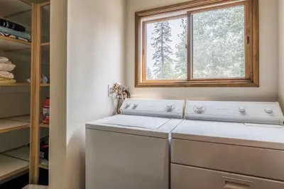 a washing machine in a kitchen with a window at Spacious 3BD & Loft Villa - Convenient to Slopes in Mammoth Lakes