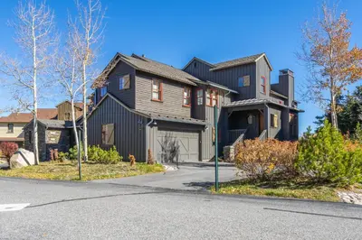 a large black house with a driveway at Lodges 1178 - Timber Lodge Retreat in Mammoth Lakes