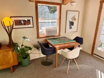 a room with a desk with chairs and a window at Tahoe Park HOA l Palisades l Hot Tub l Dogs OK in Tahoe City