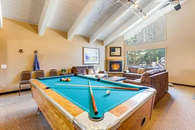 a living room with a pool table in it at Mammoth Mtn Ski-InandOut Condo with Hot Tub Access! in Mammoth Lakes